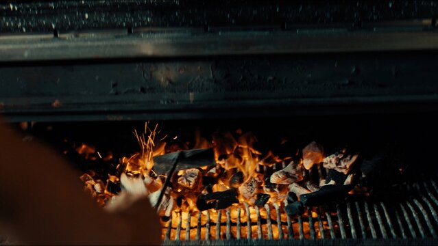 Close-up of a barbecue grill with burning charcoal