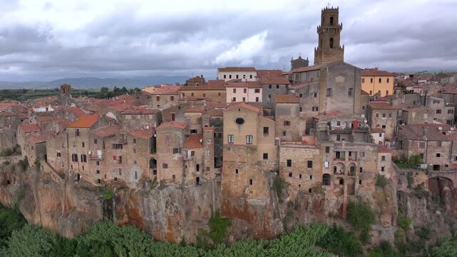 Aerial Drone view of hilltop Medieval town of Pitigliano, Tuscany in Cloudy Weather, with Valdorcia and old buildings