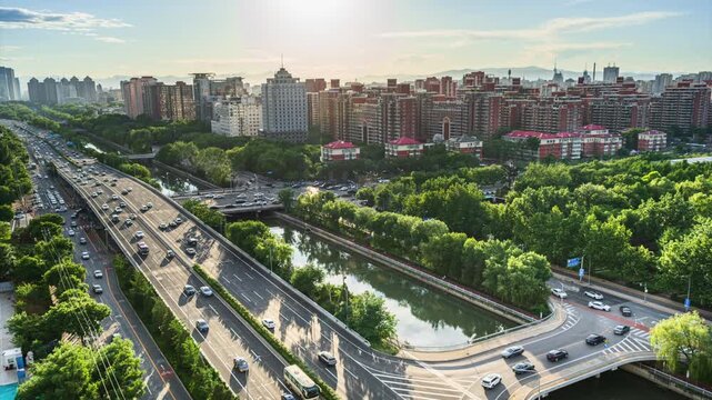 Traffic congestion delayed at overpass along Beijing's moat in the afternoon sun.