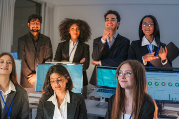 Obraz premium Team of analysts collaborating on a data project in a airy startup office, driving the project forward, in a scene about analytics and positive business spirit in a professional setting.