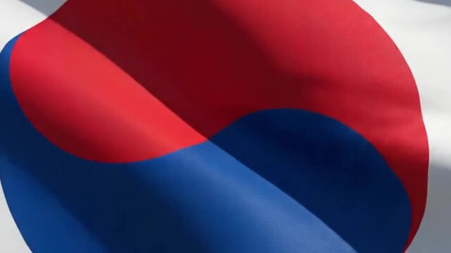 South korean flag waving in the wind against a clear blue sky