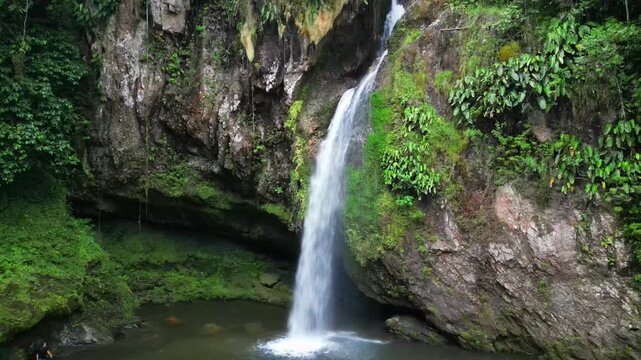 Captivating drone footage showcasing the majestic Brisas Waterfall in Cuetzalan, Mexico. Serene nature.