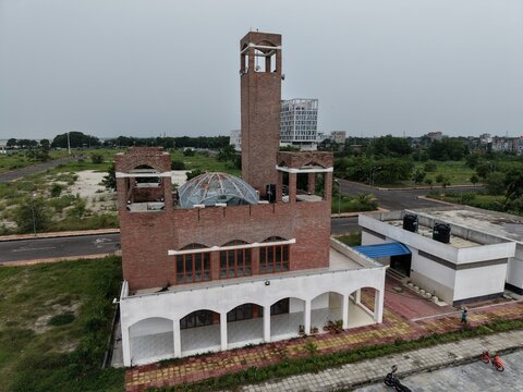 Modern building with clock tower in urban area