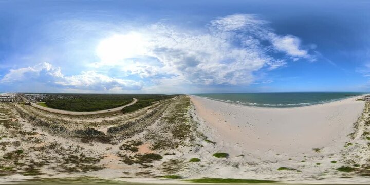 Aerial 360 VR footage of Florida beach dunes by the sea