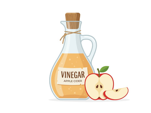 A glass bottle of apple cider vinegar with fresh apple slices and a wedge