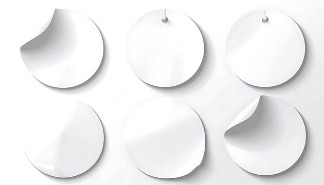 Set of isolated round white adhesive stickers with curled edges and paper tags for product labeling and branding mockups