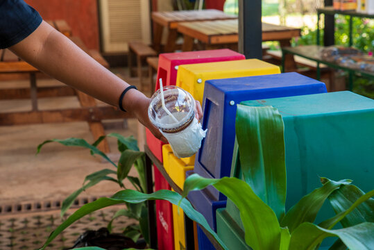 Reuse, reduce, recycle sorting process sustainable lifestyle rubbish dustbin plastic box in green garden. . Trash cans for sorting garbage recycle bin waste plastic container collection