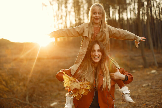 Cute and stylish family in a autumn park