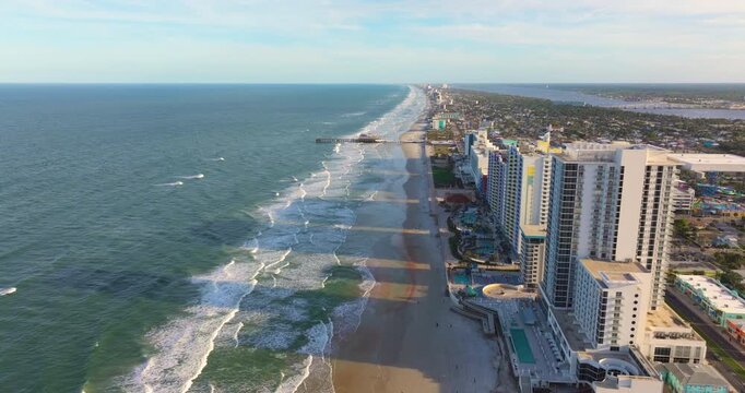 Aerial view of Daytona Beach, Florida. American coastal city with luxury hotels, condos and tourist infrastructure along the sandy Atlantic shoreline.