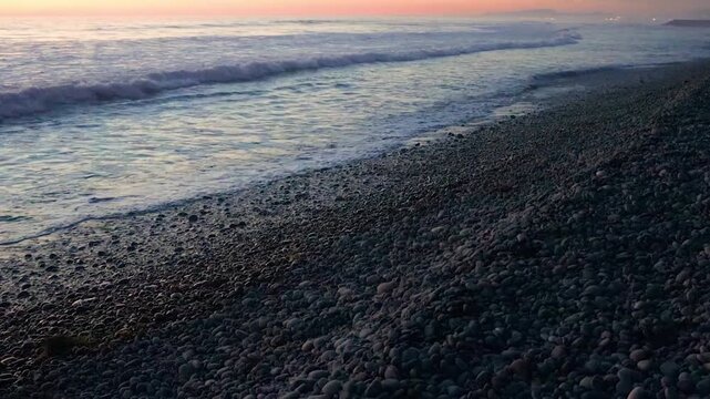 Colorful Sunset Over Rocky Shoreline of Grandview Surf Beach, Encinitas, California, USA