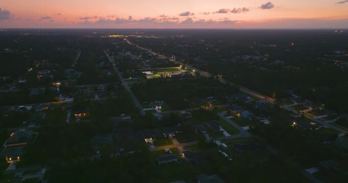 Residential sprawl with scattered homes and streets in sunny Florida at sunset, illustrating land development, infrastructure expansion and suburban lifestyle in the USA.