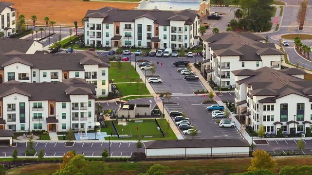 Aerial view of Florida suburban condos at sunset. Housing growth and residential architecture in U.S. communities.