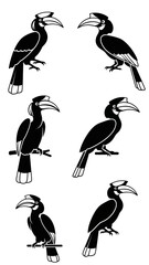 Obraz premium Black Silhouette Hornbill Birds Perched on Branches - Minimalist Vector Illustration