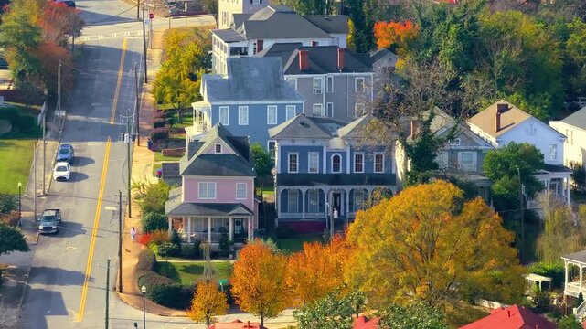 Historical American city architecture. Macon, old city in Bibb County, Georgia. Streets and Victorian houses surrounded by yellow fall trees.