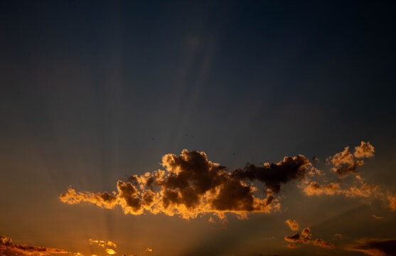 fire in the sky - joyful rays coming from the clouds