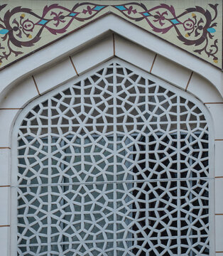 Intricate geometric islamic pattern carved stone window with middle eastern geometric architecture decorative ornamental traditional cultural construction ornament building artistic