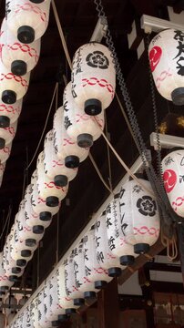 Rows of Traditional Japanese Paper Lanterns Hanging at Kyoto Shrine