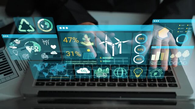 Digital Interface Display of Environmental Statistics and Renewable Energy Data with Businessman Working on Laptop. Entropy.