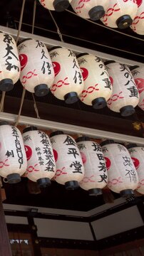 Traditional Japanese Paper Lanterns Hanging at Shinto Shrine in Kyoto