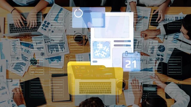 Team Collaboration Over Digital Workspace with Laptops, Charts, and Productivity Tools for Business Growth and Analysis in Modern Office Environment. Entropy.