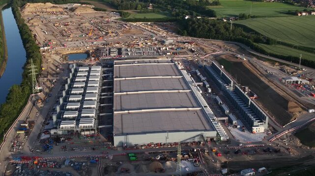 Aerial drone view of Farciennes data center expansion, showing hyperscale construction, cloud computing, server infrastructure and industrial scale digital growth.