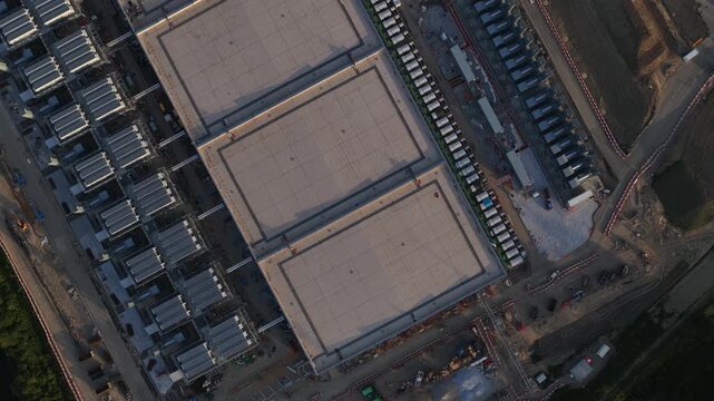 Aerial drone view of Farciennes data center expansion, showing hyperscale construction, cloud computing, server infrastructure and industrial scale digital growth.