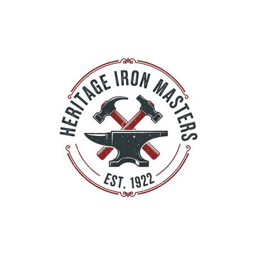 Heritage Iron Masters blacksmith logo with crossed hammers and anvil.