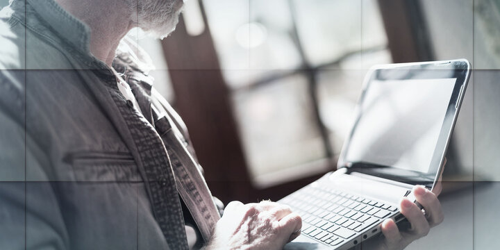 Businessman working at home, hard light effect, geometric pattern
