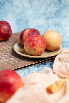 Fresh nectarine against a blue background