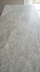 Fototapeta premium Modern grey limestone texture background in white light polished empty wall paper. luxury gray concrete stone table top desk view concept grunge seamless, Rustic marble slab. 