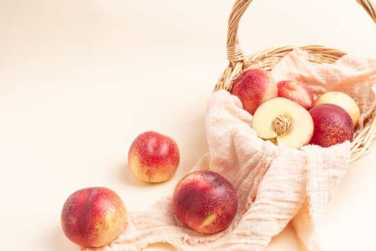  Fresh nectarine against a beige background