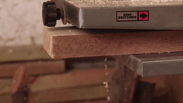 Joinery production. Carpentry equipment. Thickness planer electrical professional machine processing plank. Powerful timber industry tool.