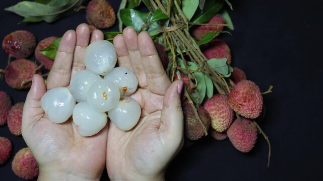 delicious lychee fruit arrangement with peeled flesh and ripe whole lychees