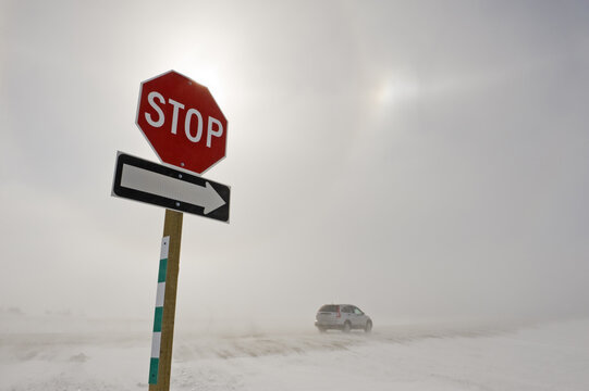 road covered with blowing snow during a blizzard, near Morris, Manitoba, Canada