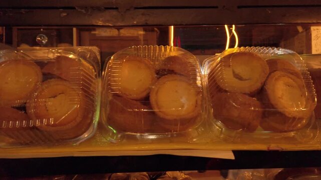 Packaged sweet bread displayed inside a bakery showcase, highlighting traditional baked goods prepared for retail sale in Mexico