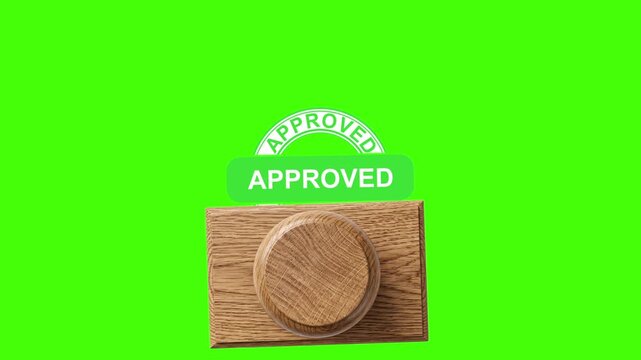 Orange approved stamp seal with wooden handle on green screen orange approved stamp, wooden stamp, approval seal, stamp imprint, green screen, chroma key, verification, certified, quality control, ove