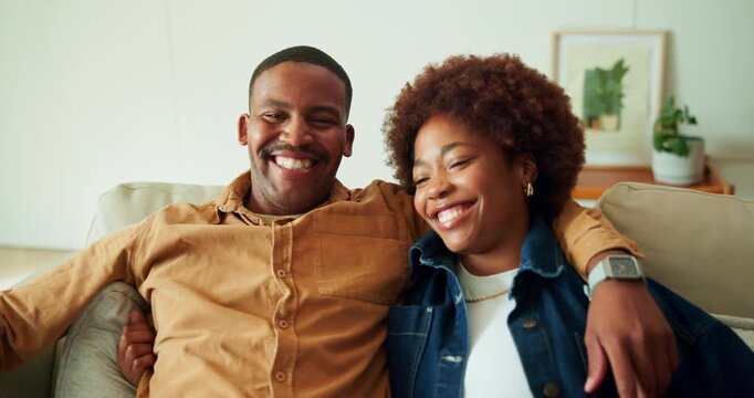 Happy couple, face and hug on couch, home and bonding with partner in lounge or connection on break. Black people, embrace and affection for spouse in living room, laughing and smile in apartment