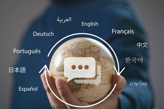 Global communication with hand holding world globe surrounded by multilingual language icons, translation, international business, cross cultural communication, localization, global connectivity.