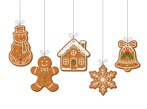 Assortment of festive Christmas gingerbread cookies including a snowman, gingerbread man, house, bell and snowflake hanging