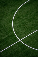 Obraz premium Artificial turf soccer field lines abstract geometric pattern in vibrant green with bright white markings on textured synthetic grass surface for sports background design.