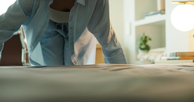 Hands, woman and making bed for maintenance, responsibility and housework at apartment. Person, clean blanket and tidy bedroom with fresh fabric, daily chores or morning routine with mattress at home