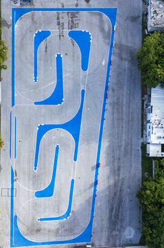 Aerial view of the Autodromo Yucatan race track featuring blue and grey asphalt sections with tire marks in Progreso, Yucatan, Mexico.