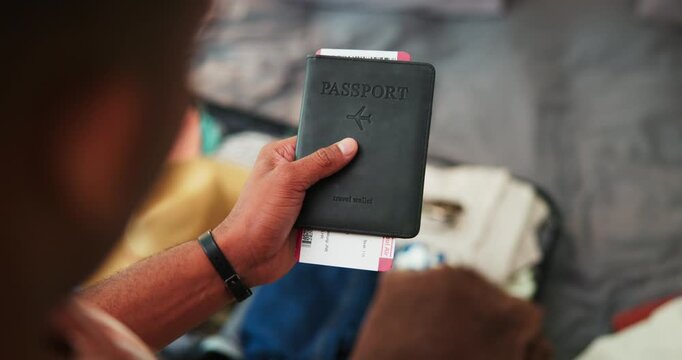 Packing, suitcase and hands of man with passport in home for flight, holiday or international trip. Ticket, luggage and male person in bedroom for preparing with travel document for overseas vacation