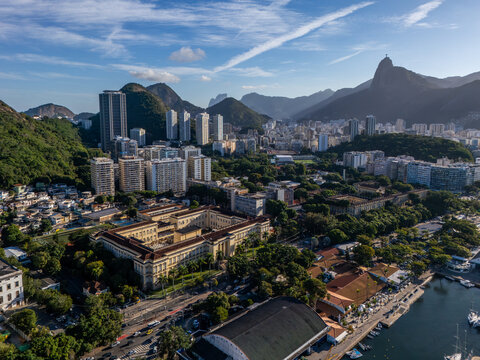 Aerial view of Botafogo featuring the historic Palacio da Cidade, surrounding high-rise buildings, lush green hills, and the bay in Rio de Janeiro, Rio de Janeiro, Brazil.