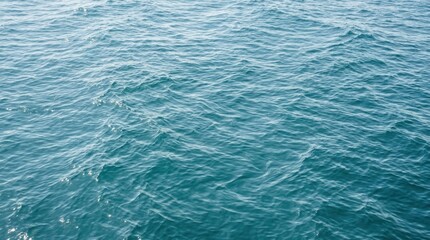 Obraz premium Deep Blue Ocean Water Surface Texture with Gentle Ripples for Backgrounds and Abstract Nature Concepts for Travel and Environmental Design Projects