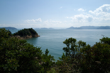 Obraz premium Beautiful bright ocean view of the Seto Inland Sea from Naoshima island with mountains, Japan