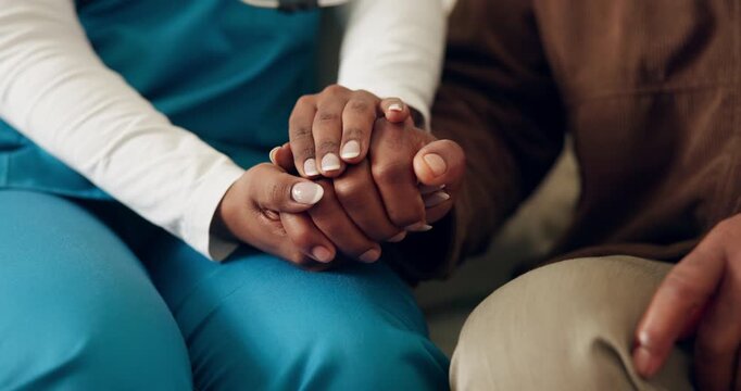 Caregiver, holding hands and senior person with support, comfort and trust together in retirement home. Elderly patient, medical help and nurse with empathy, console and compassion in living room