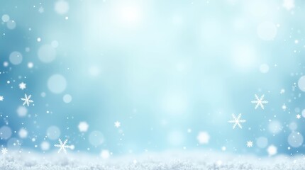 Fototapeta premium Beautiful winter background with falling snowflakes and soft blue glowing light bokeh