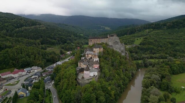 Drone Shot Flying Around Orava Castle with Scenic Mountain Landscape