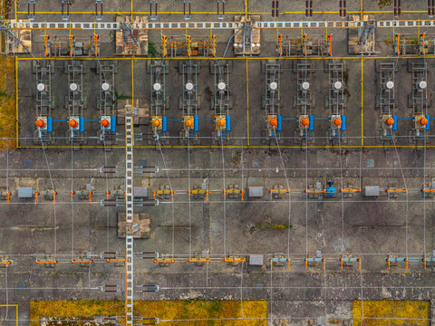 Aerial view of an electrical substation with transformers, power lines, and industrial equipment in Hodonin, South Moravian Region, Czechia.